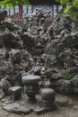 Rocks and stone seatings in Chinese garden on Huxin Island in South Lake in Jiaxing, China Royalty Free Stock Photo