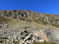 Rocks and stones in the autumn Alpine environment of the Albula Alps and above the Swiss mountain road pass Fluela