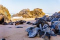 Rocks and stones on coastline of sandy Adraga beach