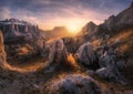 Rocks and stones at colorful sunset in autumn in Dolomites, Italy