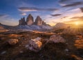 Rocks and stones at colorful sunset in autumn in Tre Cime