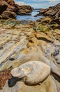 Rocks and stones on the Pacific Coast shore Royalty Free Stock Photo