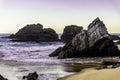 Rocks and stones at sandy beach at sunrise, Portugal Royalty Free Stock Photo