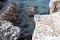 Rocks and stones in the sea. Sea stones. Rough stone surface texture Royalty Free Stock Photo
