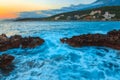 Rocks and their reflection in the sea at sunrise Royalty Free Stock Photo