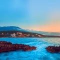 Rocks and their reflection in the sea at sunrise Royalty Free Stock Photo