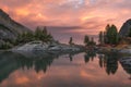 Rocks And Trees Reflecting In Pink Waters Of Sunset Mountain Lake, Altai Mountains Highland Nature Autumn Landscape Royalty Free Stock Photo