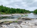 Rocks, trees and water on a river in Ontario, Canada