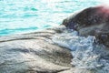 Rocks in tropical sea with gentle waves flowing through. Royalty Free Stock Photo