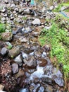 ROCKS UNDER THE WATERFALL AT CANTRAL JAVA