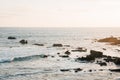 Rocks and waves in the Pacific Ocean at sunset, in Laguna Beach, Orange County, California Royalty Free Stock Photo