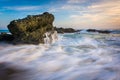 Rocks and waves in the Pacific Ocean at sunset Royalty Free Stock Photo