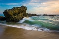 Rocks and waves in the Pacific Ocean at sunset Royalty Free Stock Photo