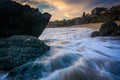 Rocks and waves in the Pacific Ocean at sunset Royalty Free Stock Photo