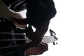 Rockstar in biker leather jacket playing solo on bass guitar Royalty Free Stock Photo