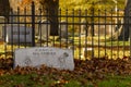 A tombstone in the grave yard by historic Saint Mary`s Church with fallen leaves covering it