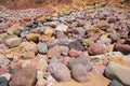 Rocky algarve coast with colorful stones, yellow red and grey Royalty Free Stock Photo