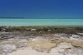Rocky Bahama Beach with Sailboat