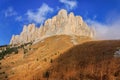 Rocky bastion of Bolshoy Big Tkhach mountain peak in Caucasus Mountains at autumn. Scenic blue sky landscape Royalty Free Stock Photo