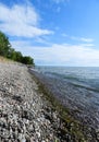 Steep rocky beach shoreline on Lake Ontario Royalty Free Stock Photo