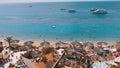 Rocky Beach with Arabic Cafes in Retro Style on the Red Sea Coast with Umbrellas, Sun Beds and Corals. Egypt