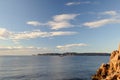 Rocky beach, beautiful views of the sea, waves and mountains. Daytime landscape, cloudy ocean coast. Empty wild beach