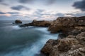 Rocky beach in blue hour at sunrise Royalty Free Stock Photo