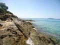 Rocky beach and clear blue water, Greece Royalty Free Stock Photo