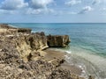 A rocky beach with clear turquoise water in Stuart, FL Royalty Free Stock Photo