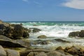 Rocky beach and its waves on the coast of the city of Salvador Royalty Free Stock Photo