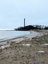 Rocky Beach On Lake Erie With Coal Plant