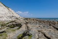 The rocky beach at low tide, near Beachy Head in Sussex, on a sunny summer\'s day Royalty Free Stock Photo