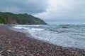 Rocky beach next to rough ocean water - Gros Morne, Newfoundland, Canada