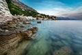 Rocky Beach and Small Village near Omis at Dusk Royalty Free Stock Photo