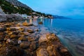 Rocky Beach and Small Village near Omis in the Evening Royalty Free Stock Photo