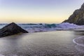 Rocky beach at sunrise, Adraga, Portugal. Travel background Royalty Free Stock Photo