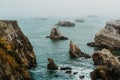 Rocky beach sunset at dusk, California coastline Royalty Free Stock Photo