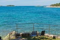 Rocky beach with two chairs in Istria Royalty Free Stock Photo