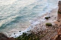 Rocky beach with waves at sunset from above Royalty Free Stock Photo