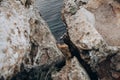 Rocky cliff and beautiful sea on sunset rays Royalty Free Stock Photo