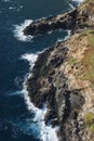 Rocky cliff on coast.