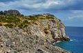 Rocky cliff at the edge of the Mediterranean Sea Royalty Free Stock Photo