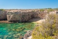 Rocky cliff and transparent sea in the natural reserve of Plemmirio, near Syracuse