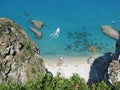 Rocky cliffs above the sea and beach Royalty Free Stock Photo