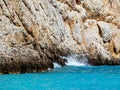 Rocky cliffs and amazing blue sea - wave crashing on the cliff Royalty Free Stock Photo