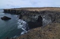 Rocky Cliffs with Basalt Columns Along the Coastline