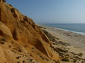 rocky cliffs in sand from GalÃÂ© beach in Melides in the municipality of GrÃÂ¢ndola