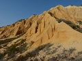 rocky cliffs in sand from GalÃÂ© beach in Melides in the municipality of GrÃÂ¢ndola