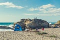 Rocky cliffs, sandy beach, and people enjoying beautiful sunny day. Montana de Oro State park, Los Osos, California Central Coast Royalty Free Stock Photo