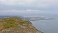 Rocky Cliffs with shrubs along the north sea coast of howth , ireland Royalty Free Stock Photo